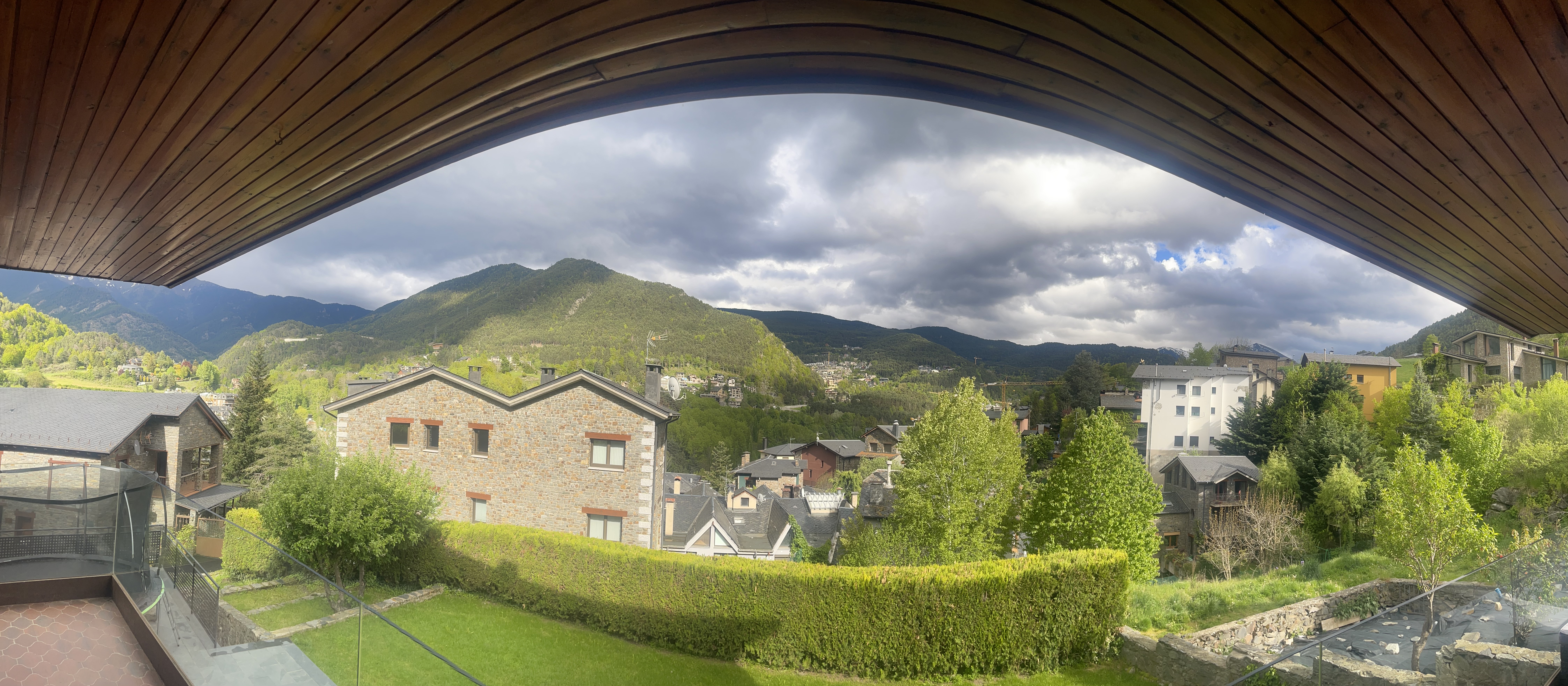 Panoramic mountain view from the chalet garden on a rainy day, La Massana